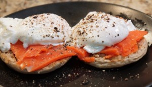 Wild caught smoked salmon with organic eggs on an english muffin.