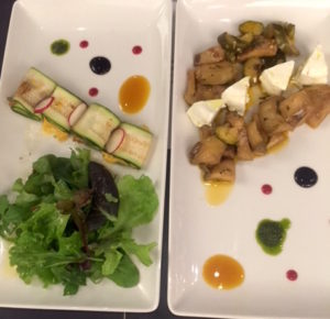 At the left, zucchini wrapped deliciousness. At the right, highly picked aubergine and zucchini with goat cheese.