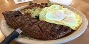 10oz Marinated Skit Steak, 3 eggs over easy with home fries from The Country Deli in Chatsworth.