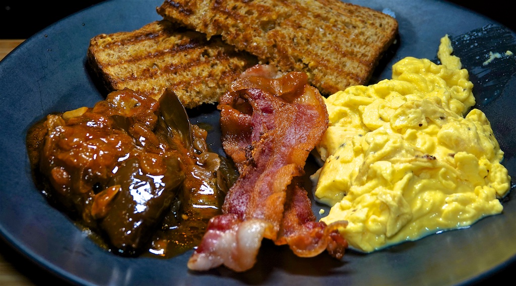 Dec 4: Popeye’s Fried Chicken with Pinto Bean & Andouille Stew; Scrambled Eggs, Bacon and Eggplant with Tomato