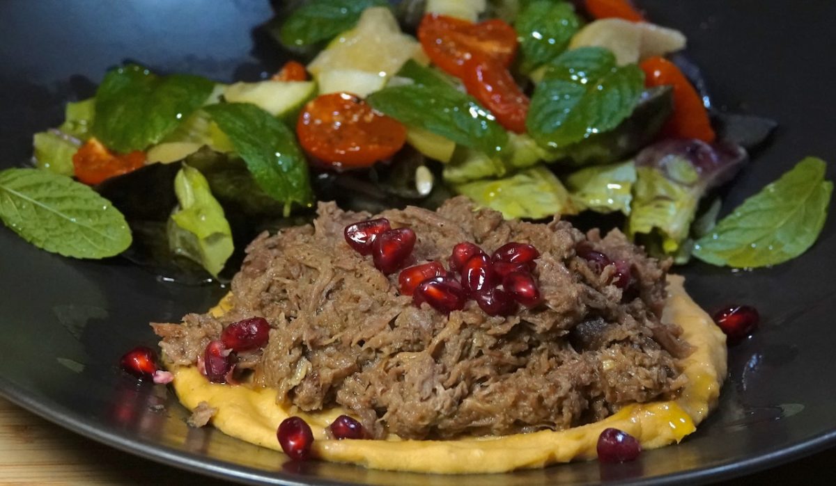 Nov 28: Warm Shredded Lamb on Hummus with Pita, with a Lettuce, Cucumber, Tomato and Preserved Lemon Salad