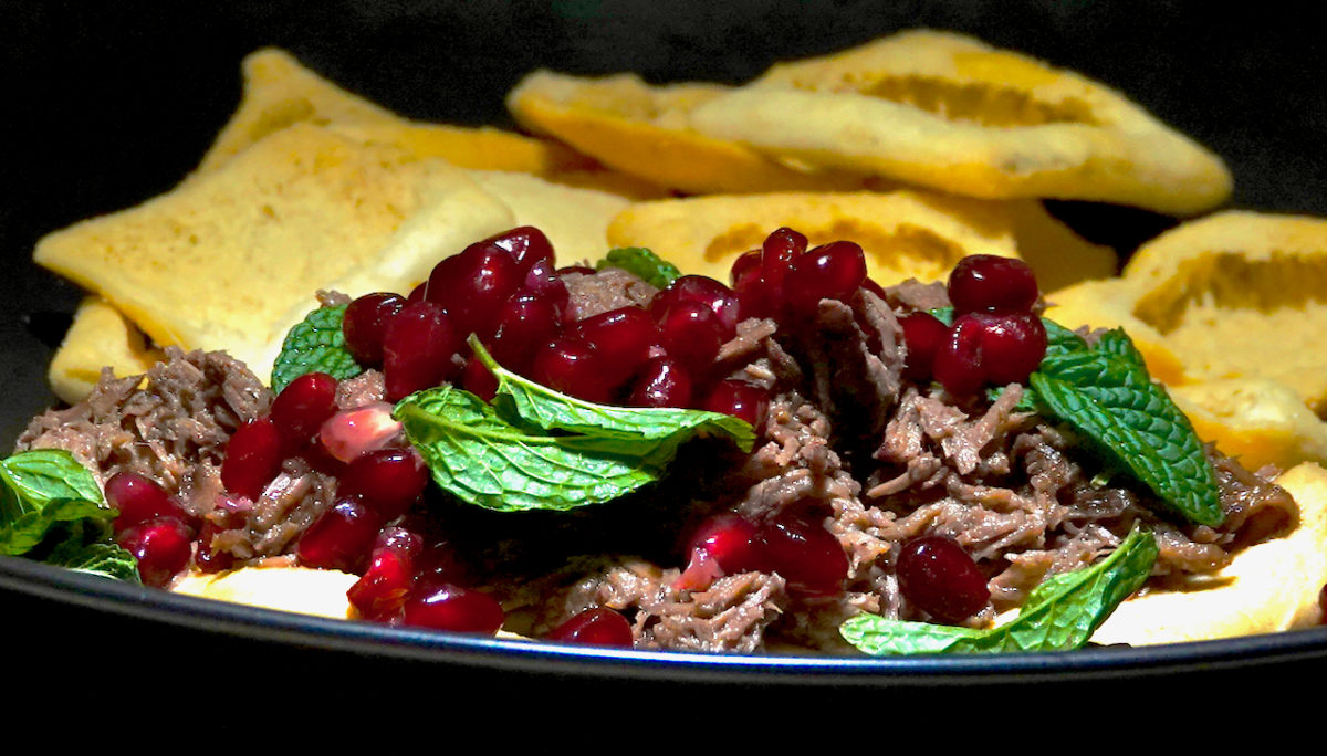 Feb 12: Warm Shredded Lamb on Hummus with Pita Chips, and a Lettuce, Cucumber, Preserved Lemon and Mint Salad