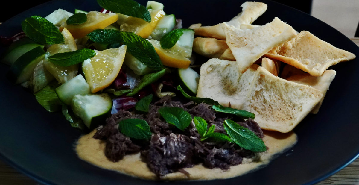 May 14: Warm Shredded Lamb Salad on Garlic Hummus with Pita Chips and a Lettuce, Cucumber, Preserved Lemon and Mint Salad