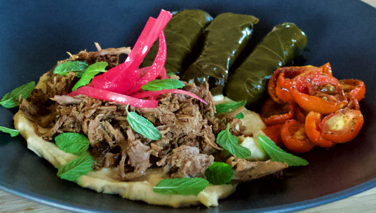 Sep 22: Warm Shredded Lamb on Hummus with Dolmas, Mint and Moonblushed Cherry Tomatoes